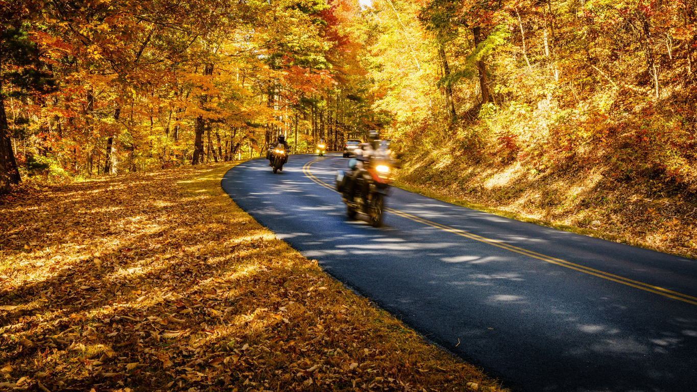 Group of motorcyclists on Blue Ridge Parkway in North Carolina in fall